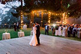 Outdoor wedding dance floor ideas. First Dance With String Lights And Outdoor Dance Floor