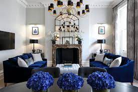 Various kinds of texture and pattern mesmerizingly decorate this living room with navy blue walls. How To Combine Blue And Gray In Your Living Room