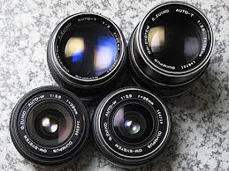 The earliest change was merely cosmetic: Zuiko Wikipedia