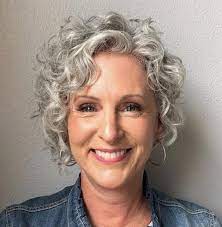 Tame flyaways while simultaneously creating shapely sleekness by straightening hair in a swooping . Short Curly Gray Hairstyle For Older Women Shortcurlyhairstyles Short Curly Haircuts Grey Curly Hair Curly Hair Styles