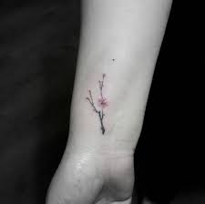 Tiny Cherry Blossom Tattoo On Wrist By Tattoo With Me Wristtattoos Trendy Tattoos Finger Tattoos Tiny Tattoos