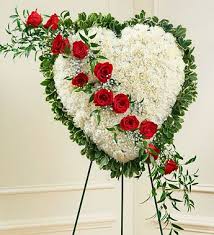 The eternal rest standing heart is a beautiful example of bright feminine colors. Red And White Funeral Flowers Funeral Flower Arrangements Flower Arrangements