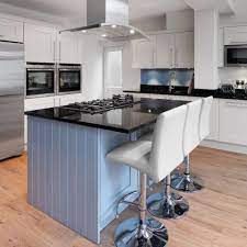 A custom kitchen featuring an island that offers a breakfast bar counter with seats set on the hardwood flooring. Deluxe High Back Stool White Atlantic Shopping