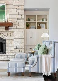 A Set Of Blue Stripe Accent Chairs Pair With Matching Ottomans In A Living Room Atop Light Blue And Cottage Renovation Stripe Accent Chair Cottage Living Rooms