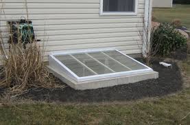 Sloped window well covers are designed to drift away rainwater and snow. Value Of Custom Window Well And Window Well Covers Steelway Cellar Doors