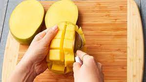 To do so, locate the stem and mentally draw a straight line down to the point of the mango. How To Cut A Mango The Easiest And Best Way To Peel A Mango