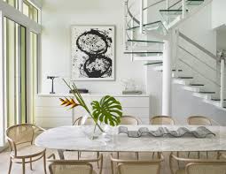 Basket Weave Chairs Surround The Table In The Casual Dining Area Custom Designed Cabinetry Beneath The Interior Design Townhouse Interior Best Interior Design