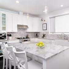 Super white quartzite is an increasingly popular trend both among homeowners and interior designers. Super White Quartzite Everything You Need To Know White Transitional Kitchen Transitional Kitchen Bar Stools Kitchen Island