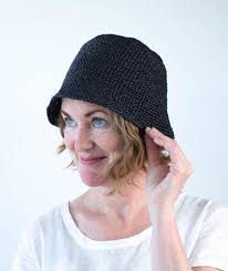 The model is 177 cm in height and wears a size 36. Joanne Hat Using Wool And The Gang Ra Ra Raffia Churchmouse Yarns Teas