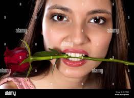 Woman rose in mouth hi-res stock photography and images