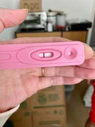 This is positive right? I know I'm testing early (10 days after unprotected  sex) but I feel pregnant. : rMommit