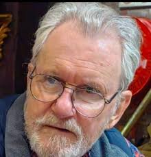 Sharing for a friend. I think he'd look smart in one of the many caps  around him.