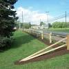 Fence rails can be installed between or across posts, using hangers, nails or screws to fasten them. 1