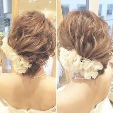 weddinghair flower ウェディングヘア フラワー updo ポイントを左手に寄せて 前からもヘアアクセが見えるようにすると 華やかに見えるし小顔効果も 結婚式 ヘアスタイル ヘアアレンジ hairs 花嫁 髪型 ボブ 結婚式 髪型 ボブ ヘア