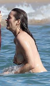 Busty Marion Cotillard enjoying a topless swim 16 photos