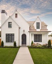If you watch those american reno shows you'll notice that they are a big fan of painting an old tired brick facade. Q A White Painted Brick Exteriors Becki Owens