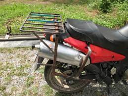 If that's all you plan to haul, you don't need to modify your factory rack. Motorcycle Luggage Racks Adventure Motorcycling Handbook