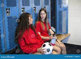 Two Soccer Teammates in a Locker Room Smiling Together after Soccer  Practice Stock Image - Image of laughing, candid: 181593351