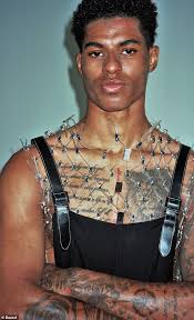 Marcus rashford lifts up his short to show off his new inkingcredit: Marcus Rashford Takes Centre Stage In Edgy New Cover Shoot Latest Celebrity News