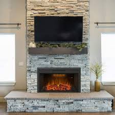 For a completely modern aesthetic, place a narrow, long fireplace below knee height. 34 Corner Fireplace Ideas Burn It With Style