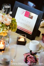 Table Centerpiece Of Soft Pink Roses And Green Hydrangea In Square Vase Square Votive Holders Wrapped With Ribbon B Blue Orchids Square Vase Green Hydrangea