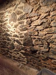 We take out the crumbling rotting mortar and put new in. Repointing A Stone Wall With Lime Mortar Row House Living