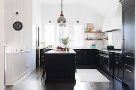 You can add a casual, somewhat rustic look to your kitchen design with distressed kitchen cabinets. The Black Kitchen Cabinet Trend Heather Hungeling Design