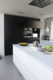 Below shows an archetypal example of white kitchen cabinets in a minimalist kitchen. 34 Timelessly Elegant Black And White Kitchens Digsdigs