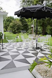 Use outdoor patio tiles to create spaces. Painted Patio Tile Diy A Beautiful Mess