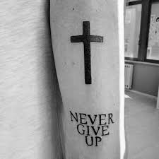 The reason for it is quite simple: 60 Never Give Up Tattoos For Men Phrase Design Ideas