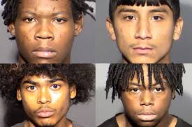4 teens formally charged in connection with beating death; Vigil held