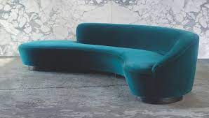 If you have a living room that is challenging to arrange or you just want something different, a curved sofa. Freeform Curved Sofa Holly Hunt