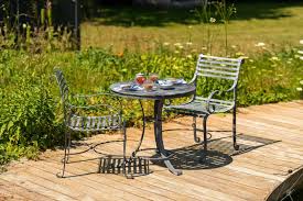 These pared down sets can be placed just about anywhere outside to create an intimate seating area. Southwold Bistro Table Set Harrod Horticultural