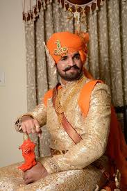 In indian communities, it is customary for the bridegroom to travel to the wedding venue (often the bride's house) on a mare, accompanied by his family members. Rajput Groom Groom Photoshoot Indian Wedding Photography Couples Wedding Dress Men