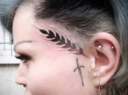 Talking about funny tattoo ideas for men, this tattoo is a little chocolate icing mascot with its tongue hanging out. 123 Incredible Face Tattoos For Men And Women Cool Check More At Https Tattoorevolution Com Face Tattoo Designs Face Tattoo Face Tattoos Facial Tattoos