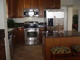 Detract from the heavy look of oak cabinets by opting for lighter tones in other areas of your kitchen. Counter And Oak Cabinets Appliances Kitchen Stainless Steel Oak Cabinets Kitchen Appliances