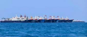 Philippines asks Chinese flotilla to leave reef