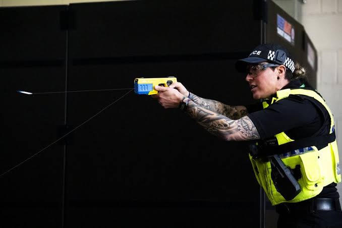 Greens U-turn on 'mad' plan for police to lose Tasers and batons