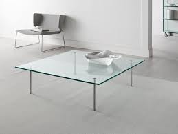 This square coffee table with glass top embodies all the best features of modern design. Glass Coffee Table With Metal Legs