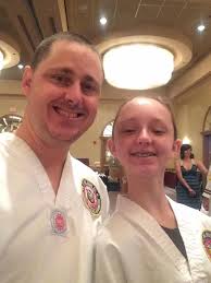 Family celebrates blackbelt day anniversary