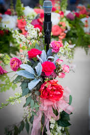 Flower Adorned Microphone Stand At A Ceremony Weddings Floral Arrangements Wedding Diy Centerpieces Wedding Decorations