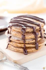 Churro Pancakes With Spicy Chocolate Sauce Cooking On The Front Burner