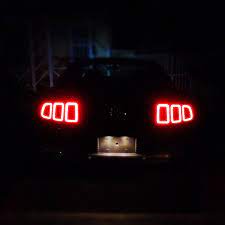 The Rear Tail Lights Of My 2013 Ford Mustang At Night