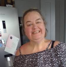 My daughter has used white tak in her uni accommodation to put posters up  and is now stressing as it's left grease type marks. Any suggestions how to  get them off please?