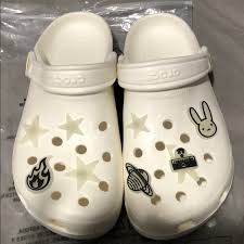A pair of classic crocs you'll love customizing to show off your personality *and* cherish for how darn comfortable they are (haters be damned!). Crocs Shoes Bad Bunny Crocs Poshmark