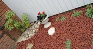 This home depot guide gives you tips on how to use landscape fabric, choose decorative stones and apply mulch. Vigoro 0 5 Cu Ft Bagged Decorative Stone Red Lava Rock 440897 The Home Depot Stone Landscaping Landscaping With Rocks Fall Landscaping