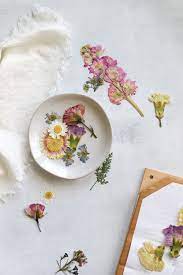 Pressing flowers in a flower press or a book is a better method to use if you plan to use the dried flowers for more than just decorating. How To Press Flowers Make A Diy Flower Press Hello Nest