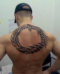Therefore, when someone chooses a tribal design to ink in his or her skin, it's in fact a form of dating back to almost 5 thousand years ago, tribal tattoos are very expressive, rich, passionate, and ferocious. 60 Tribal Back Tattoos For Men Bold Masculine Designs