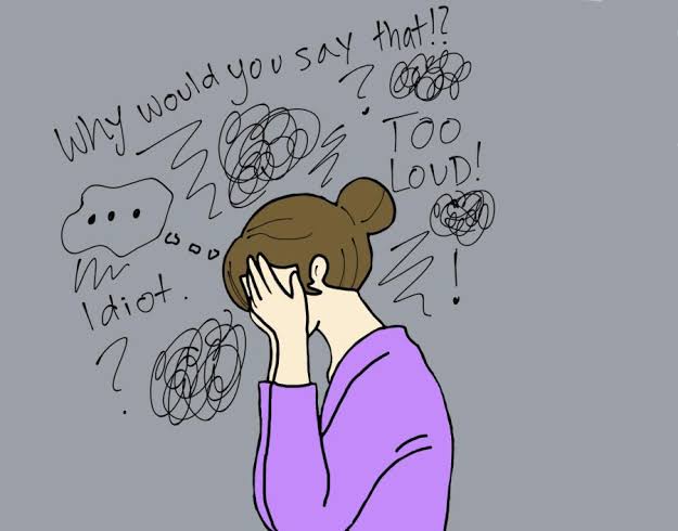 Young Malaysian adult feeling nervous in a social setting, representing social anxiety Malaysia therapy support
