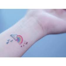 Rainbows appear as perfect arcs, often during a rainstorm when the sun shines onto water droplets, shattering its white light into an array of beautiful colours. 45 Rainbow Tattoos For The Colourful You